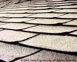 Asphalt roofing shingles with curled edges